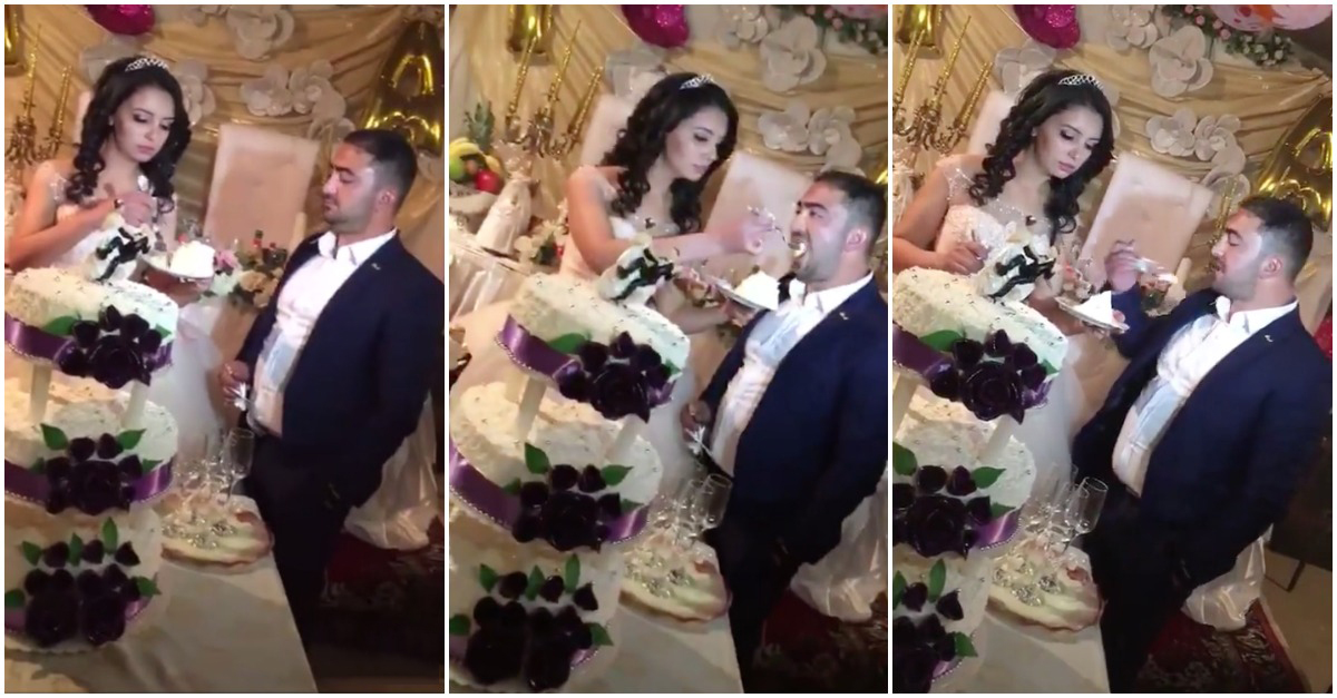 Noivo goza com a esposa na hora de partilharem o bolo de casamento